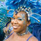 'Woman in a blue feathered costume in the Port of Spain carnival in Trinidad.' by Tom Hanslien