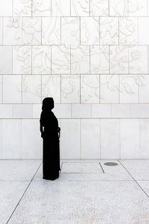 Veiled woman in front of wall by Martyn Buter