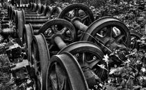 Rusting wheels of steel  by Rob Hawkins