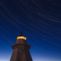 Startrails over lighthouse by Mikael Svensson