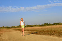 Teenage girl on the sandy road by Volodymyr Chaban