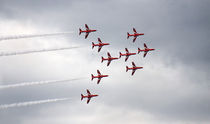 Red Arrows flying in formation  by Linda More