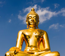 Big golden Buddha statue. by Tom Hanslien