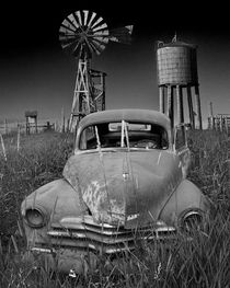 Abandoned Vintage Auto with Windmill and Water Tower by Randall Nyhof