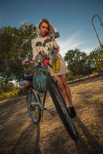 girl on with an old bicycle  by nedyalko petkov