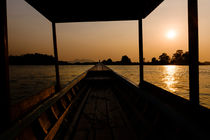 Sunset in a riverboat. by Tom Hanslien
