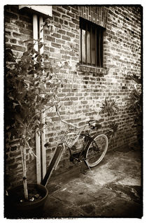 Bike in Pirates Alley by John Rizzuto