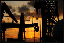 Sunset viewed from an oil rig w border by Bradford Martin