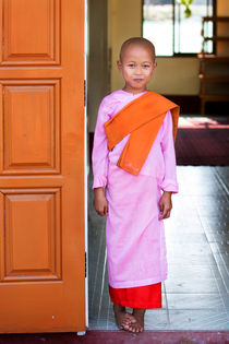 Sweet eight year old Novice Nun at That Dha Ma Myit Zu Nunnery by Matilde Simas
