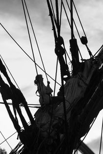 Young woman climbing in the rigging of a tall ship von Intensivelight Panorama-Edition