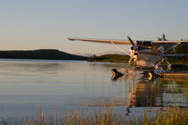 Midnight sun and plane at lake Inari von Intensivelight Panorama-Edition