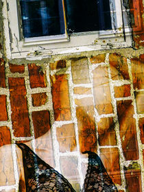 A woman under the window by Gabi Hampe