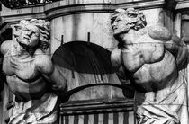 Two Male Statues above Cannes Doorway by Michael Whitaker