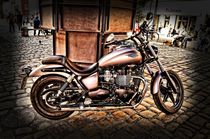 Motorcycle on the town square by Helmut Schneller
