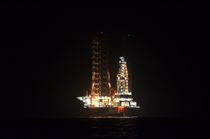 Oil Rig At Night by Malcolm Snook