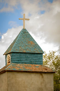 Cross and steeple on an old church by Claudia Botterweg