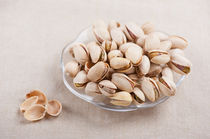open pistachio nuts in shell by Arletta Cwalina