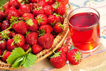 red strawberries in basket and juice by Arletta Cwalina