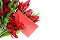 envelope in bouquet of red tulips by Arletta Cwalina