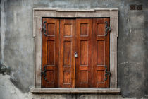 Old wooden shutters close window by Arletta Cwalina