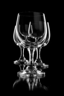 Three empty wine glasses on black by Arletta Cwalina
