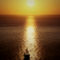 2010-09-09-sunset-sailboat-thira