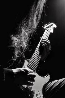 Long hair man playing guitar by Arletta Cwalina