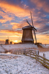 Traditional Dutch windmills in winter at sunrise by Sara Winter