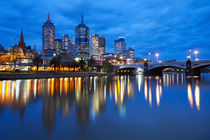 Skyline of Melbourne, Australia across the Yarra River at night by Sara Winter