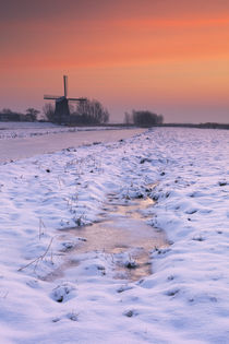 Typical Dutch landscape with windmill in winter at sunrise by Sara Winter