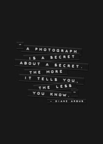 A Photograph Is A Secret Embossed Labels Black by Brian Carson