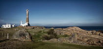 Lighthouse at Cabo Polonio behind rocks by Diana C. Bernardi