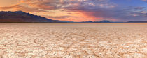 Cracked earth in remote Alvord Desert, Oregon, USA at sunset by Sara Winter