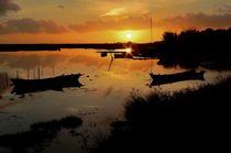Boats silhouettes at sunset by Angelo DeVal