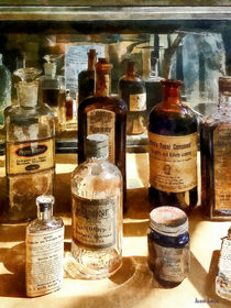Medicine Bottles in Glass Case von Susan Savad