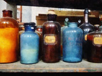 Orange, Brown and Blue Bottles of Chemicals von Susan Savad