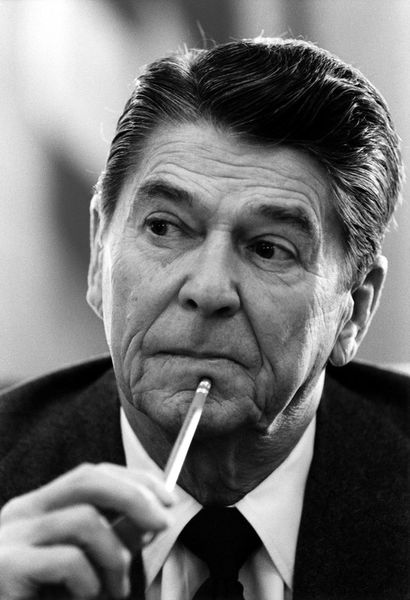 991-president-ronald-reagan-at-cabinet-meeting-with-pencil-poster-print-bw