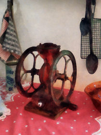 Coffee Grinder on Red Tablecloth by Susan Savad