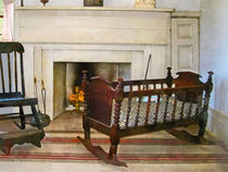 Cradle Near Fireplace by Susan Savad