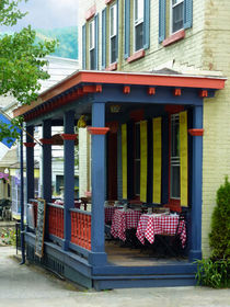 Outdoor Cafe with Checkered Tablecloths by Susan Savad