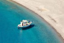 A fishing boat in Agios Minas beach of Karpathos, Greece by Constantinos Iliopoulos