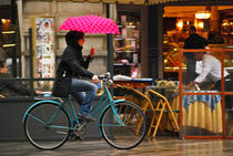 Cycling on a Rainy Day in Milan by Carlos Alkmin