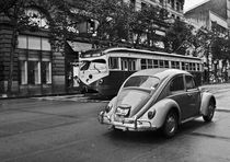 San Francisco classic street scene: a steet car tram and a VW Beetle at Market Street