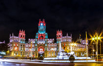 The Cibeles Palace and Cibeles fountain at night by ebjofrie