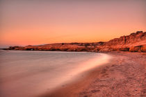 Sunset at a beach in Karpathos, Greece by Constantinos Iliopoulos