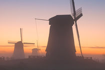 Traditional Dutch windmills in winter at sunrise by Sara Winter