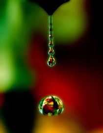 Close-up of a falling drop of water by Yuri Hope