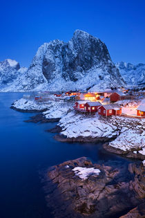 Norwegian fisherman's cabins on the Lofoten at dawn in winter by Sara Winter