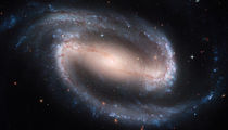 Barred Spiral Galaxy NGC 1300. by Stocktrek Images