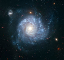 Spiral galaxy NGC 1309. by Stocktrek Images